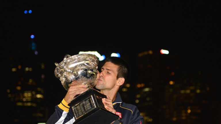 Djokovic kisses the trophy after victory in 2013