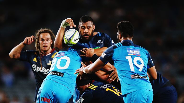 Patrick Tuipulotu of the Blues looks to offload the ball 