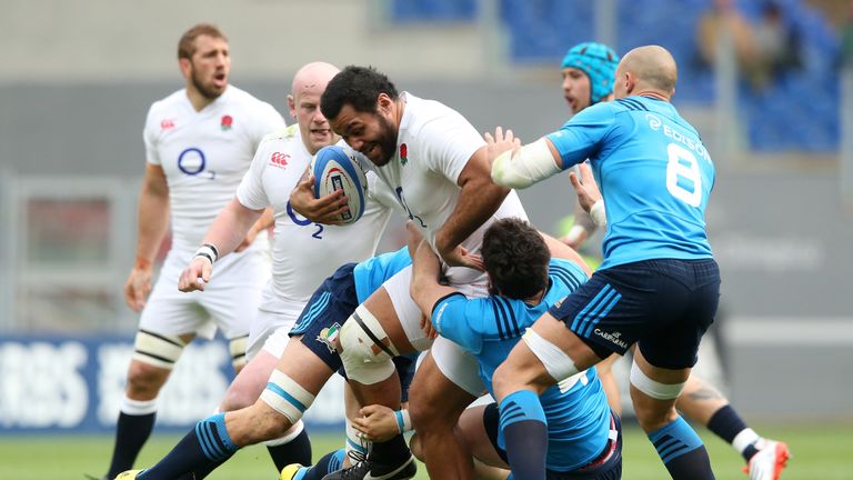 England No 8 Billy Vunipola is tackled by Italy duo Francesco Minto and George Biagi