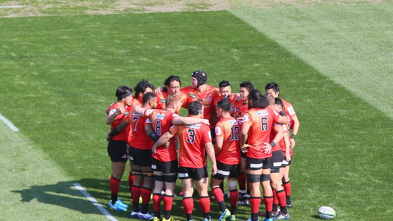 The Sunwolves players huddle ahead of their Super Rugby debut