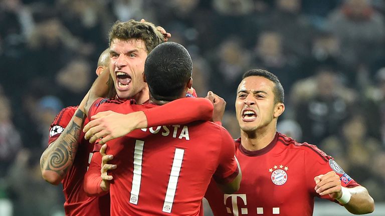 Thomas Muller (C) celebrates with teammates after scoring