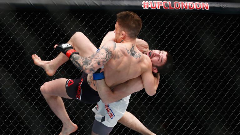 Rustam Khabilov of Russia throws Norman Parke through the air