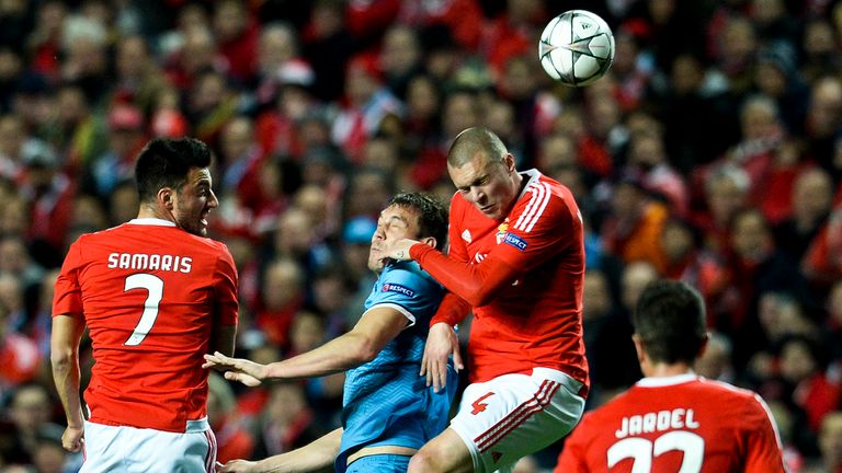 Benfica defender Victor Lindelof (second right) heads the ball with Zenit forward Artem Dzyuba