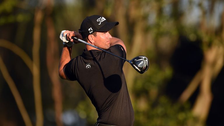 Adam Scott of Australia watches his tee shot on the third hole during the third round of the Arnold Palmer Invitational 