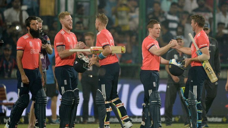 Jos Buttler and Joe Root of England celebrate with Ben Stokes and captain Eoin Morgan after winning the World Twenty20 semi-final against New Zealand