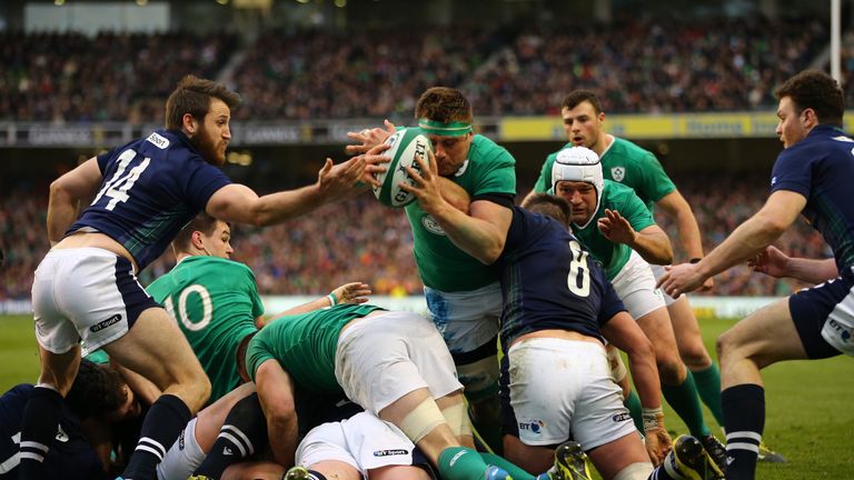  CJ Stander of Ireland dives over a maul to score the game's opening try 