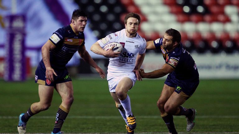 Widnes Vikings Joe Mellor skips clear of Hull Kingston Rovers' Maurice Blair and Chris Clarkson to score