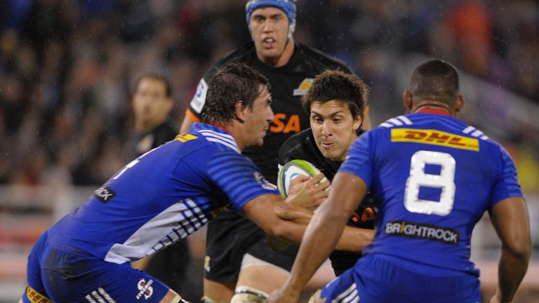 Jaguares' wing Lucas Amorosino (middle) vies for the ball with Stormers' lock Eben Etzebeth (left)