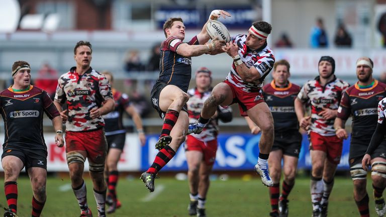 Hallam Amos and Damien Hoyland battle for a high ball