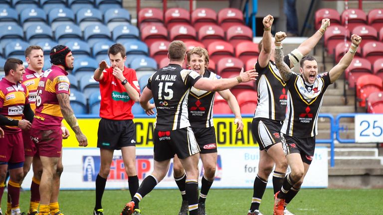 Salford players celebrate the victory at Huddersfield