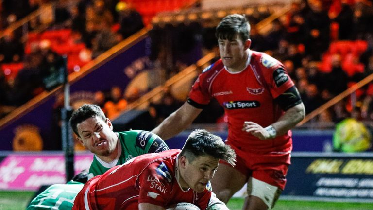 Scarlets' Steffan Evans scores his side's third try