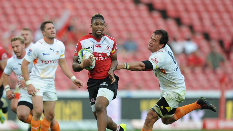 Howard Mnisi of the Lions tries to evade Henco Venter of the Cheetahs 