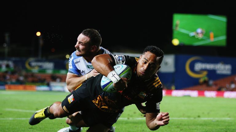 Toni Pulu of the Chiefs dives over to score a try against the Western Force