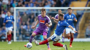 Image of Gregg Wylde being tackled by Ben Davies is heading to The Den from Home Park