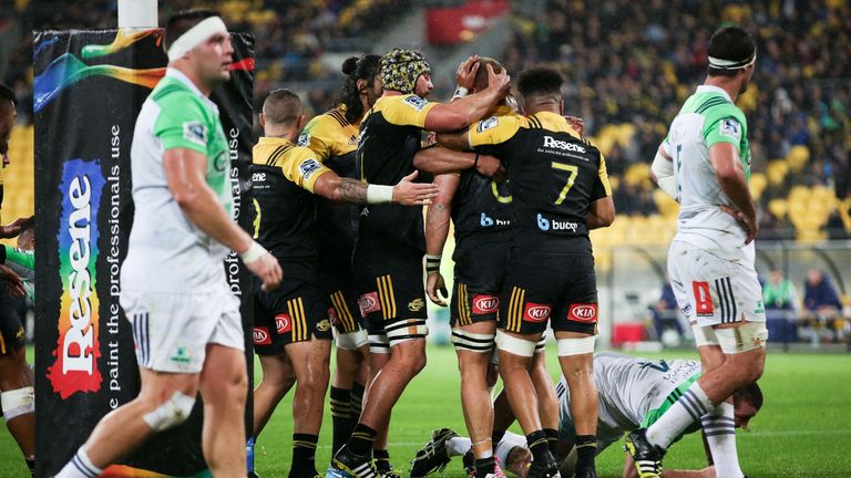 Brad Shields is congratulated on his try