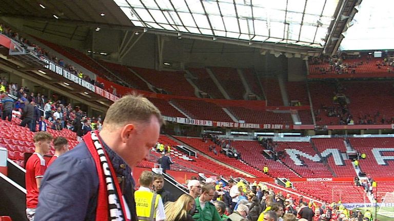 Fans make their way out of the ground having been asked to evacuate