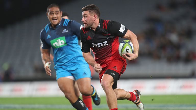 Kieron Fonotia of the Crusaders makes a break against the Blues 
