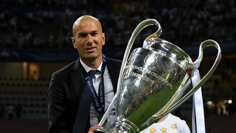 Zinedine Zidane shows off the trophy