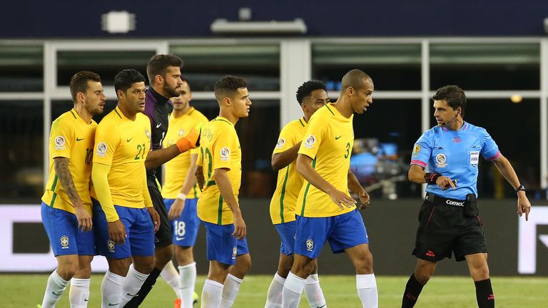 Miranda leads Brazilian protests after the goal which knocked them out of the Copa America