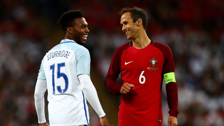 He was all smiles with Portugal's Ricardo Carvalho during the friendly at Wembley