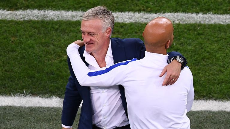 France's coach Didier Deschamps (L) celebrates victory