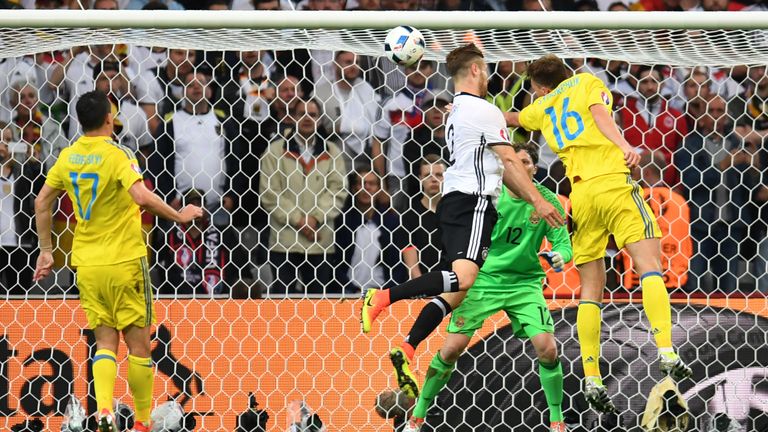 Germany defender Shkodran Mustafi (c) scores his first international goal