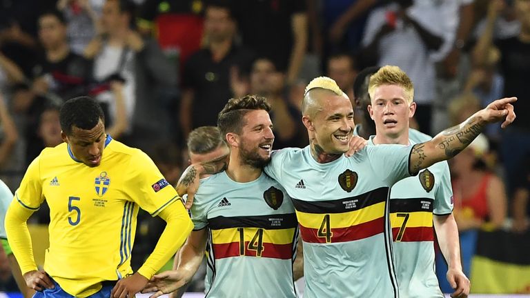 Nainggolan celebrates scoring against Sweden with Dries Mertens and Kevin De Bruyne