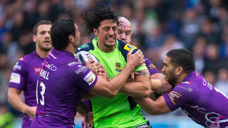 Anthony Gelling is tackled by Wigan trio Hep Cahill, Jack Buchanan and MacGraff Leuluai
