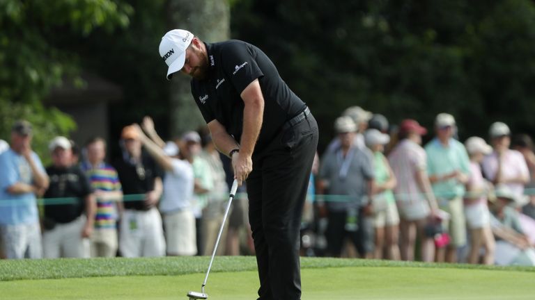 Shane Lowry cruised to five under to go two clear of the field before darkness halted play