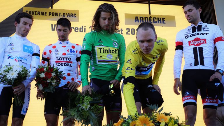 From left, Adam Yates, Thomas De Gendt, Peter Sagan, Froome and Dumoulin laid flowers for the victims of Thursday's terror attack in Nice