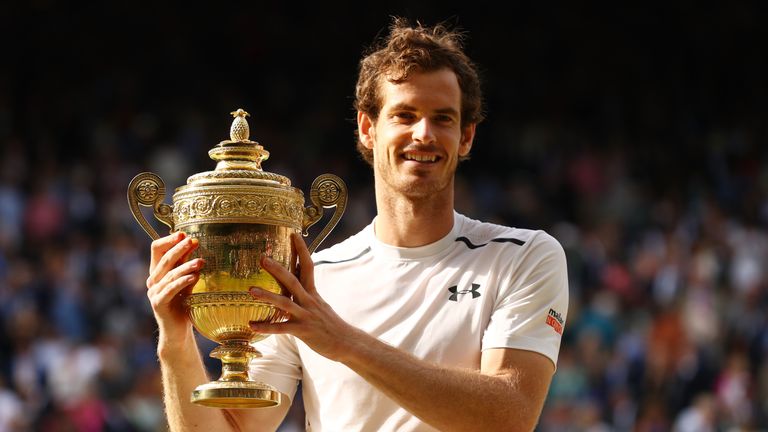 Andy Murray lifts the trophy after winning Wimbledon