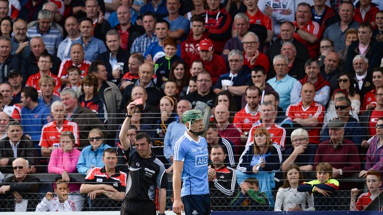 Chris Crummey of Dublin is shown a red card by referee Paul O’Dwyer