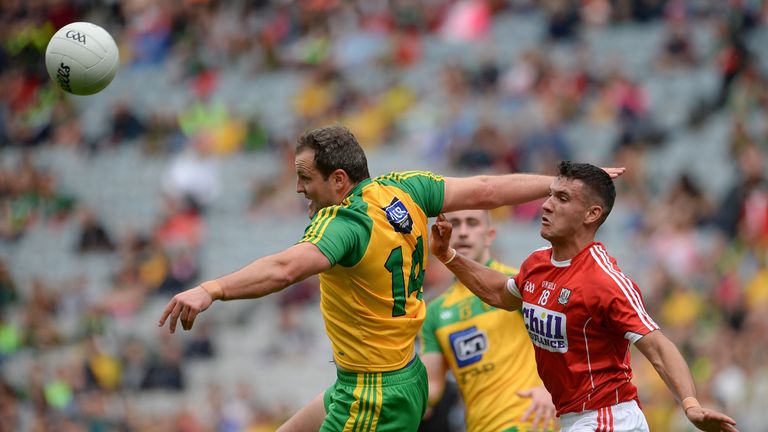 Michael Murphy and Tom Clancy battle for possession
