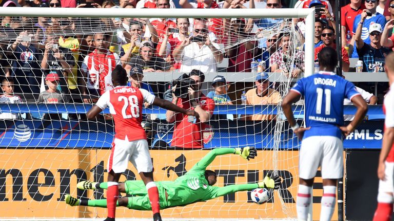 Campbell (L) hammers home a penalty to open the scoring