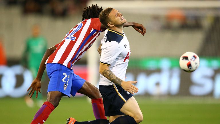 Kieran Trippier and Thomas Partey compete for the ball