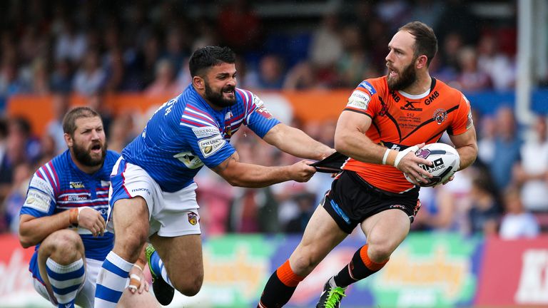 Luke Gale is tackled by Wakefield's Jason Walton