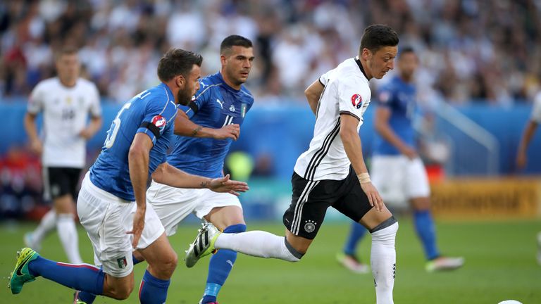 Mesut Ozil in action for Germany against Italy