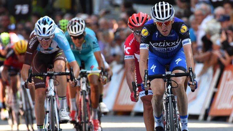 Dan Martin (right) led the chasers over the finish line, 13 seconds down on Froome