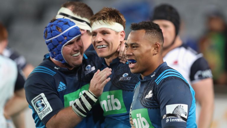 English centre Piers Francis (middle) is congratulated after scoring the Blues' second try