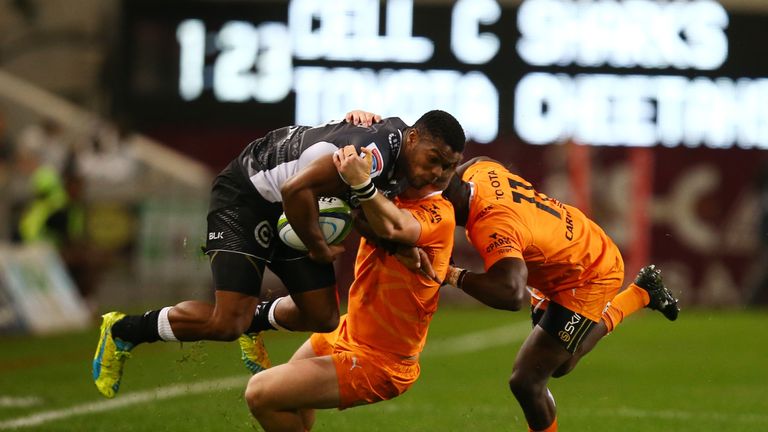 Sharks wing S'bura Sithole is tackled by Fred Zeilinga