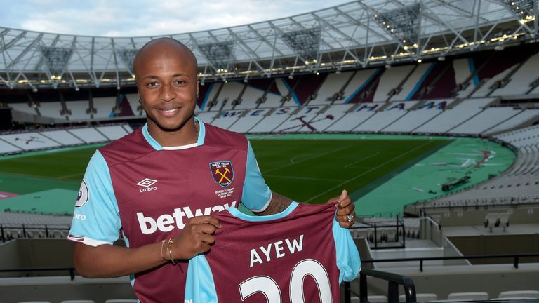 Andre Ayew poses in his new colours at the London Stadium