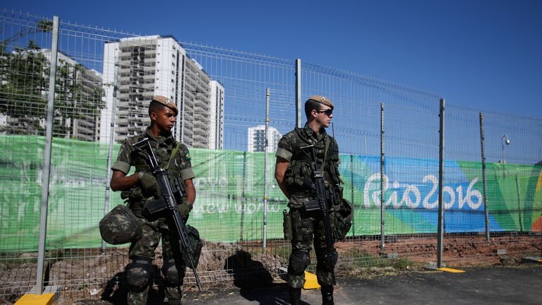 Brazilian soldiers patrol the Olympic Village