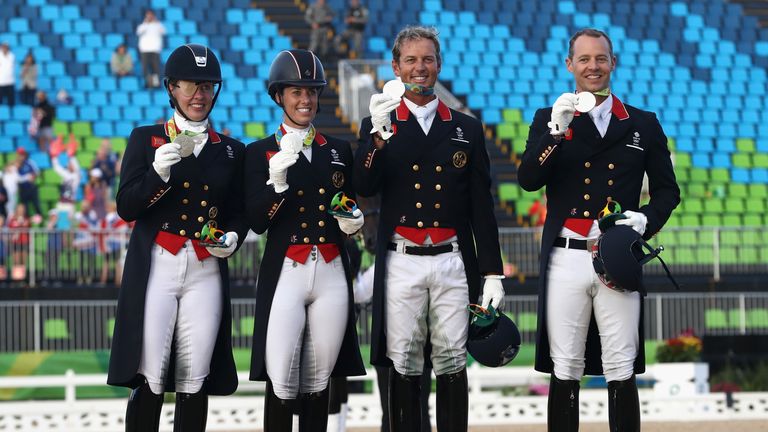(L-R) Fiona Bigwood, Charlotte Dujardin, Carl Hester and Spencer Wilton receive their silver medals