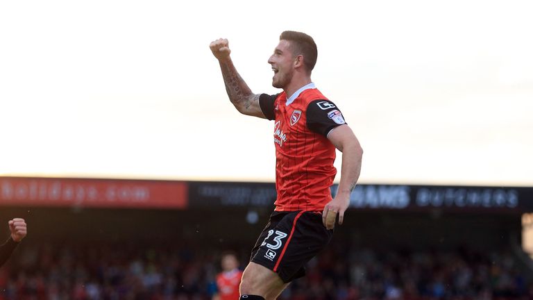 Morecambe's Cole Stockton celebrates after scoring but it proved in vain