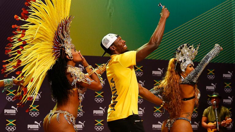 Sprint champion Usain Bolt dances the samba with entertainers at the Rio Olympics