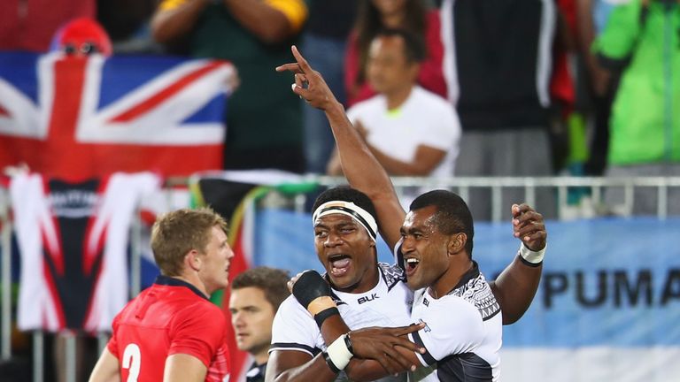 Viliame Mata and Ro Dakuwaqa celebrate as they win gold after the Men's Rugby Sevens Gold medal