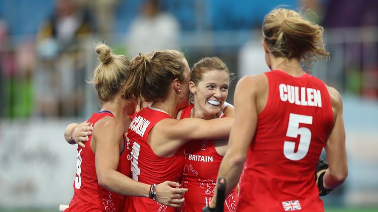 Team-mates congratulate Helen Richardson-Walsh after her second goal of the game