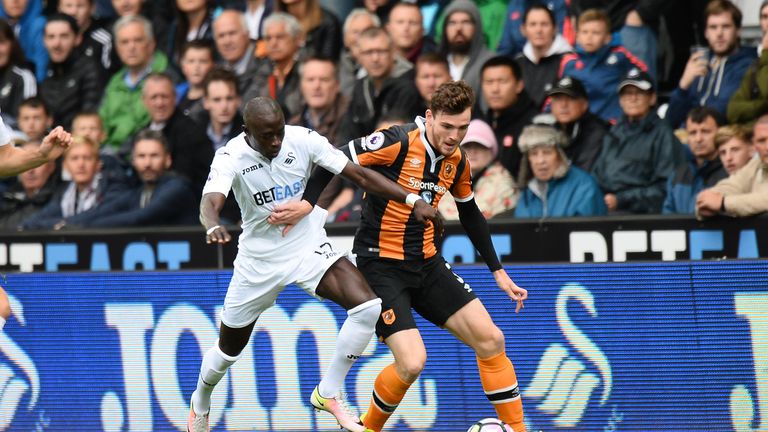 Madou Barrow of Swansea City battles for the ball with Andrew Robertson of Hull
