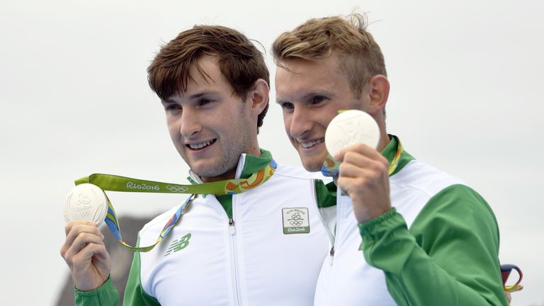Ireland's Gary O'donovan (L) and Paul O'donovan pose with their medals on the podium of the LWT Men's Double Sculls