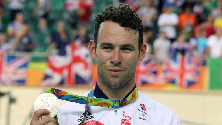 Great Britain's Mark Cavendish shows off his silver medal 